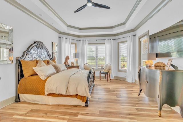 1041 Albatross Way, Gallatin, TN 37066 - bedroom featuring ornamental molding, a raised ceiling, baseboards, light wood-type flooring, and a ceiling fan