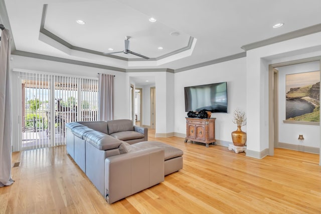 1041 Albatross Way, Gallatin, TN 37066 - living room with crown molding, a ceiling fan, light wood-style flooring, a raised ceiling, and baseboards