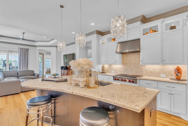 1041 Albatross Way, Gallatin, TN 37066 - kitchen featuring a chandelier, stainless steel gas cooktop, under cabinet range hood, light wood finished floors, and recessed lighting