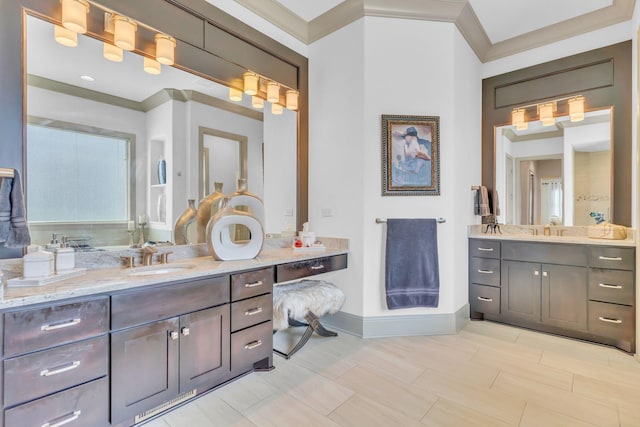 1041 Albatross Way, Gallatin, TN 37066 - bathroom featuring two vanities, crown molding, and baseboards