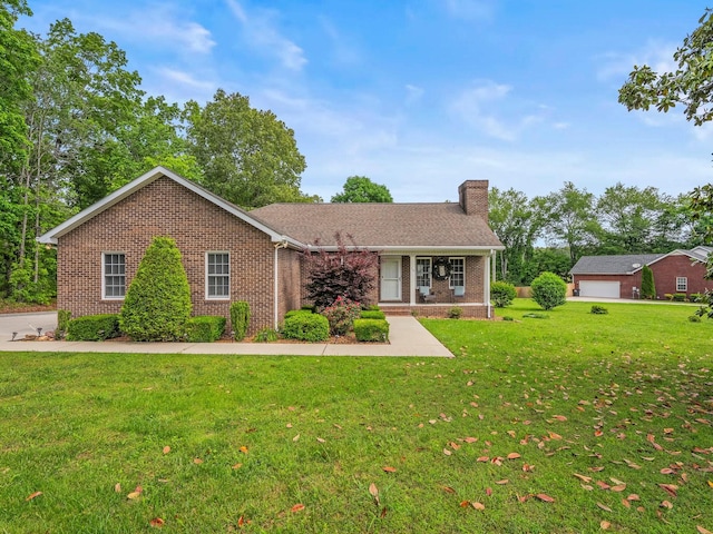 30 Sullivan Ln, Tullahoma, TN 37388 - ranch-style house featuring brick siding, a front yard, and a chimney