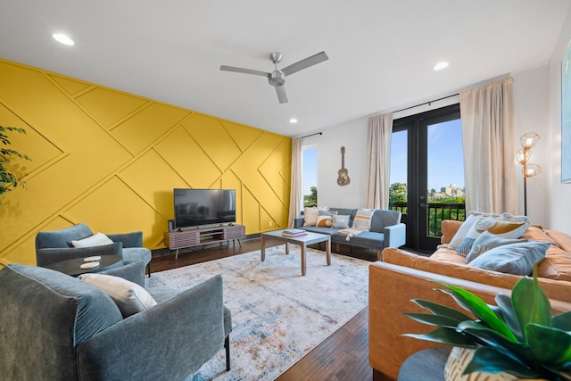 living area featuring dark wood-type flooring, ceiling fan, and recessed lighting