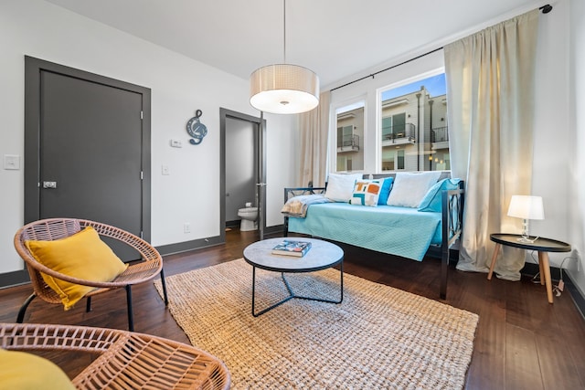 living room with wood finished floors and baseboards