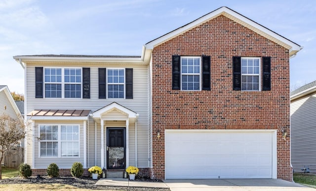 view of front of home featuring brick siding, a garage, and driveway