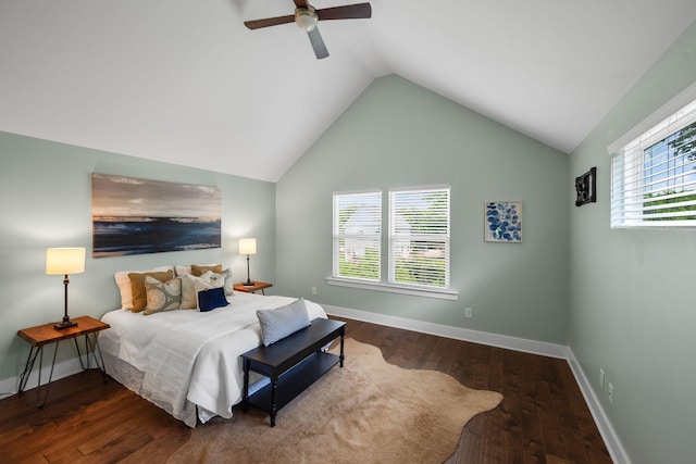 bedroom with wood finished floors, lofted ceiling, ceiling fan, and baseboards