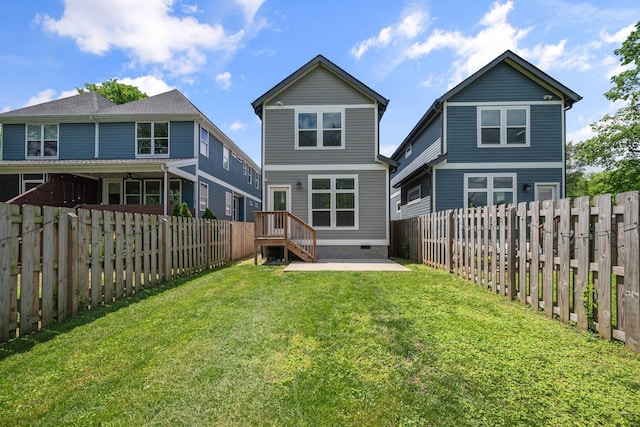 rear view of house with crawl space and a patio