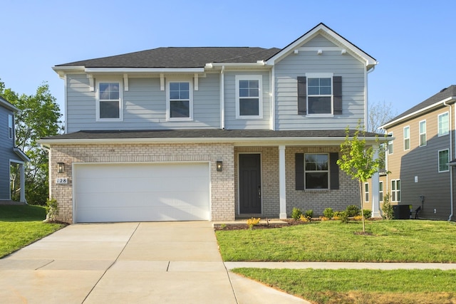 view of front of home featuring a front yard, a garage, driveway, central air condition unit, and brick siding