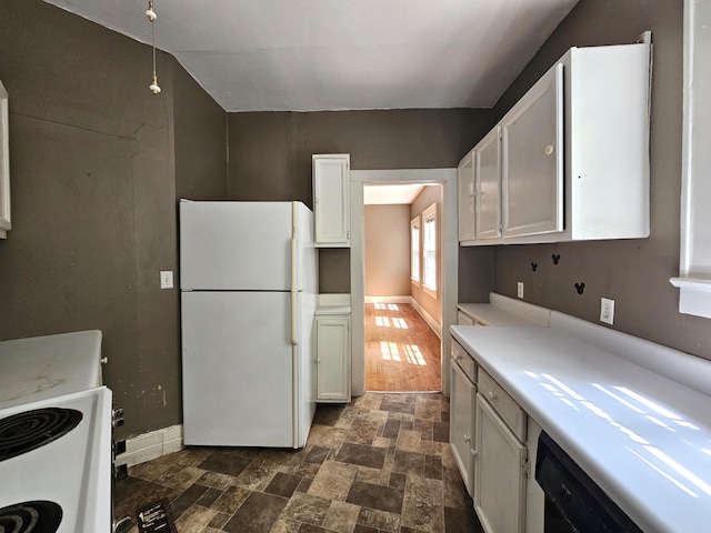 4 Mother Goose Vlg, Lookout Mountain, GA 30750 - kitchen featuring freestanding refrigerator, light countertops, stone finish flooring, and white cabinets