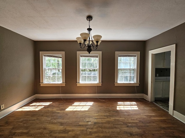 4 Mother Goose Vlg, Lookout Mountain, GA 30750 - spare room with a chandelier, dark wood-style floors, and baseboards