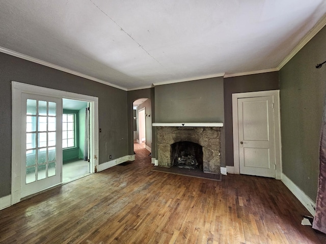 4 Mother Goose Vlg, Lookout Mountain, GA 30750 - unfurnished living room featuring arched walkways, wood-type flooring, a fireplace, baseboards, and ornamental molding