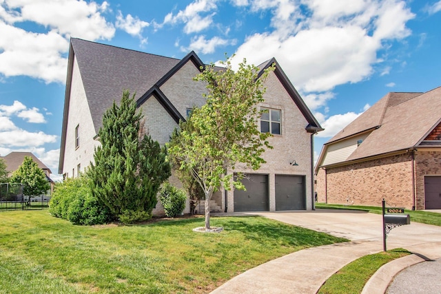 view of front of home with brick siding, driveway, and an attached garage
