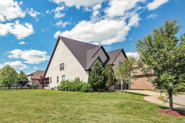view of home's exterior featuring central AC and brick siding