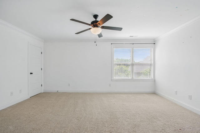 unfurnished room featuring crown molding, ceiling fan, light carpet, and baseboards