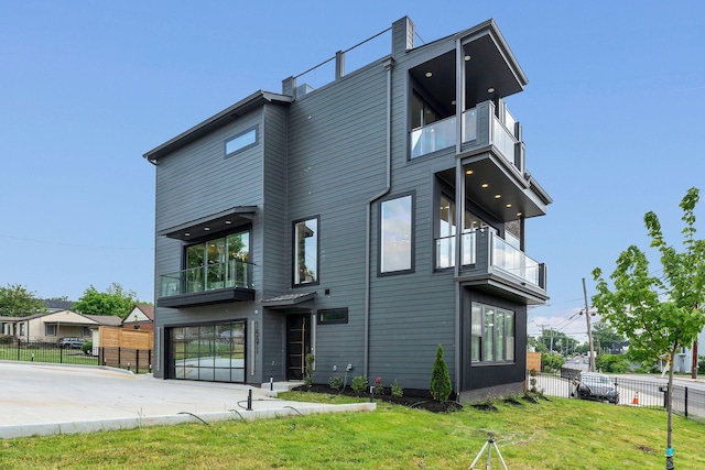 rear view of house featuring a balcony