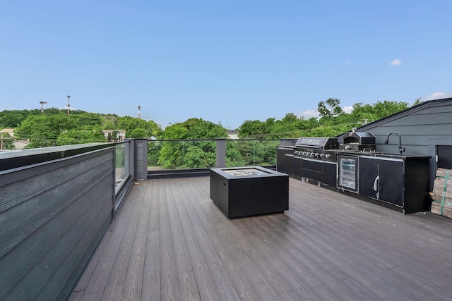 wooden deck featuring grilling area, area for grilling, and wine cooler