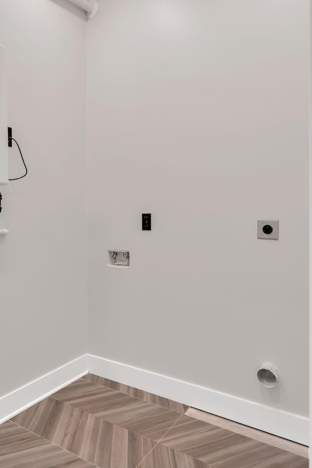 laundry room featuring washer hookup, baseboards, and electric dryer hookup