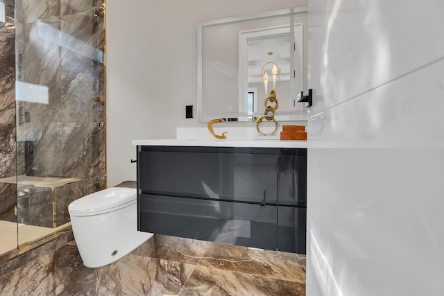 bathroom featuring a marble finish shower, vanity, toilet, and marble finish floors