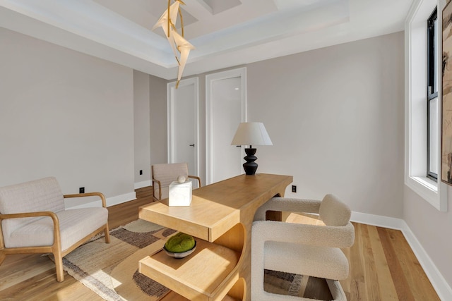 home office with light wood-style floors and baseboards