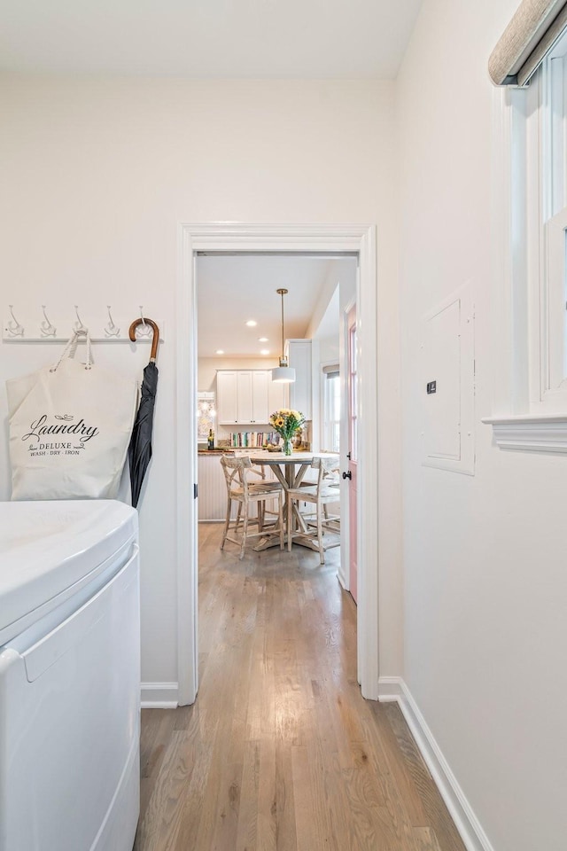 3060 Liberty Hills Dr, Franklin, TN 37067 - laundry area with light wood-type flooring, baseboards, and electric panel