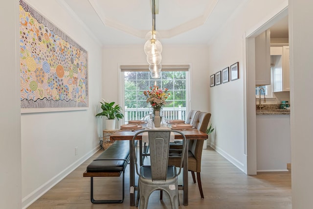 3060 Liberty Hills Dr, Franklin, TN 37067 - dining area with crown molding, wood finished floors, a tray ceiling, and baseboards