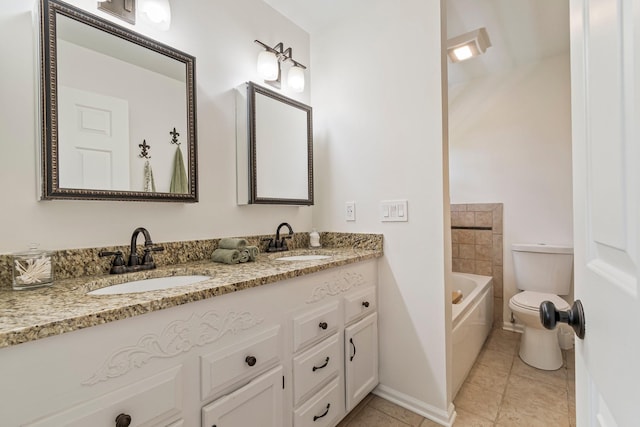 3060 Liberty Hills Dr, Franklin, TN 37067 - bathroom featuring toilet, a tub to relax in, double vanity, tile patterned flooring, and baseboards