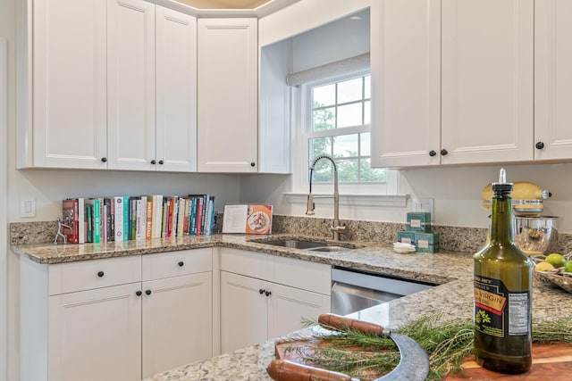 3060 Liberty Hills Dr, Franklin, TN 37067 - kitchen with a sink, white cabinetry, stainless steel dishwasher, and light stone counters