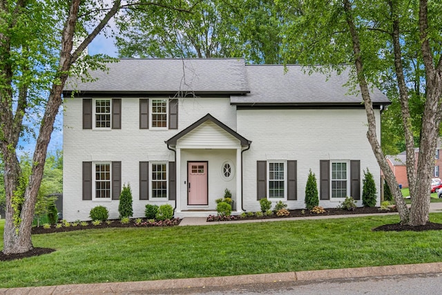 3060 Liberty Hills Dr, Franklin, TN 37067 - view of front facade with a front yard, brick siding, and roof with shingles