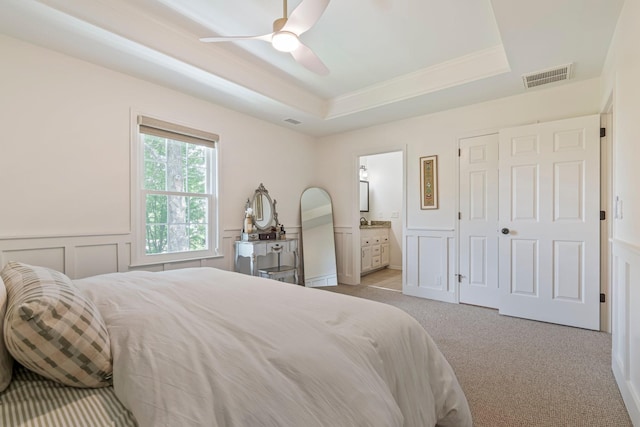 3060 Liberty Hills Dr, Franklin, TN 37067 - bedroom featuring a tray ceiling, carpet, crown molding, ensuite bath, and a wainscoted wall