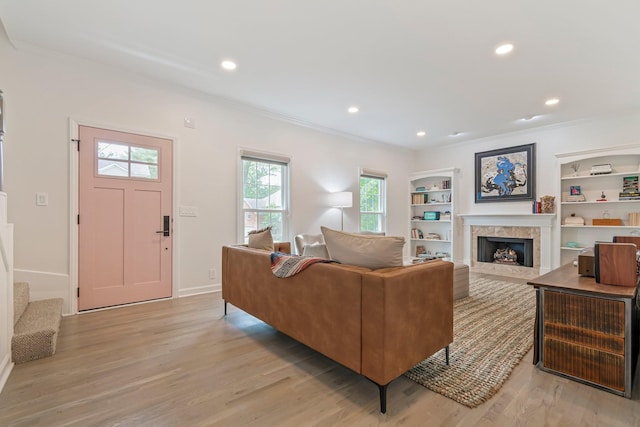 3060 Liberty Hills Dr, Franklin, TN 37067 - living room featuring light wood-type flooring, a premium fireplace, recessed lighting, crown molding, and baseboards