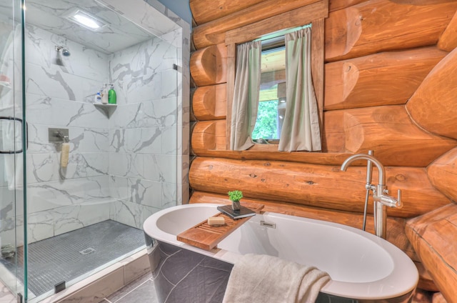 1271 Bivins Rd, Lewisburg, TN 37091 - bathroom featuring a stall shower, rustic walls, and a tub