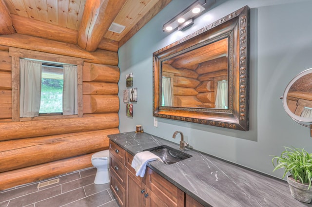 1271 Bivins Rd, Lewisburg, TN 37091 - bathroom featuring log walls, toilet, wooden ceiling, vanity, and tile patterned flooring