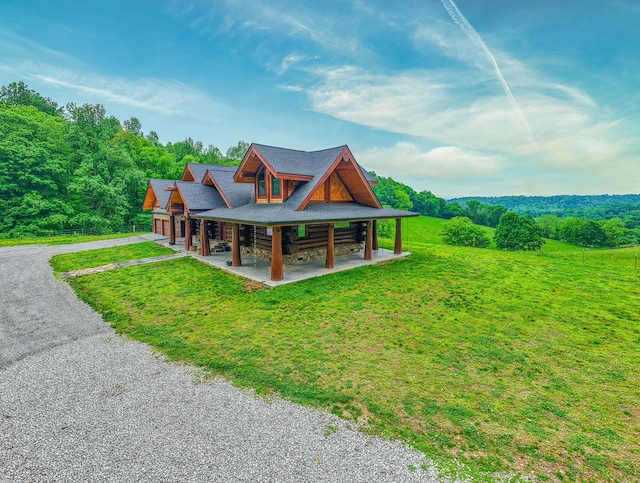 1271 Bivins Rd, Lewisburg, TN 37091 - back of property featuring asphalt driveway and a yard