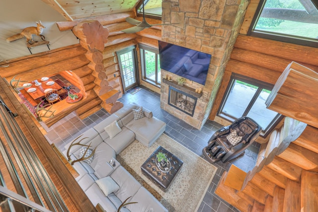 1271 Bivins Rd, Lewisburg, TN 37091 - tiled living room with rustic walls, a fireplace, healthy amount of natural light, and wooden ceiling