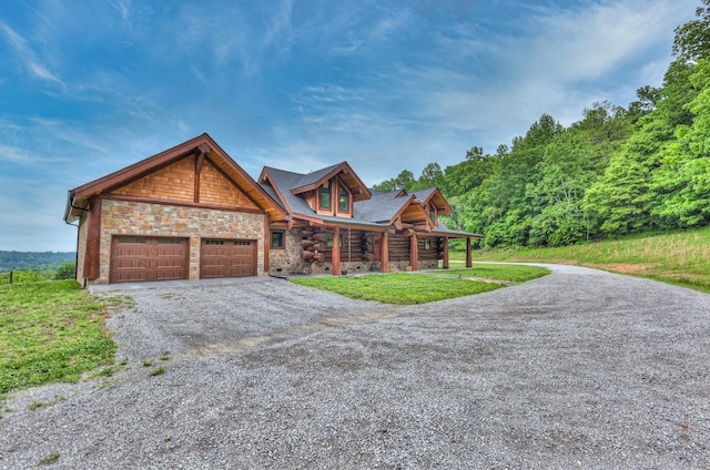 1271 Bivins Rd, Lewisburg, TN 37091 - view of front of home featuring asphalt driveway, stone siding, an attached garage, a porch, and a front lawn