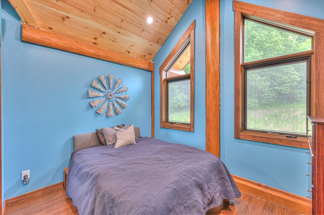 1271 Bivins Rd, Lewisburg, TN 37091 - bedroom with wood finished floors, vaulted ceiling, wood ceiling, multiple windows, and baseboards