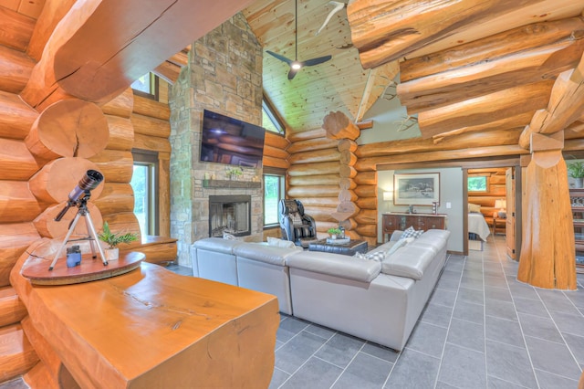 1271 Bivins Rd, Lewisburg, TN 37091 - tiled living room featuring rustic walls, high vaulted ceiling, a stone fireplace, healthy amount of natural light, and wood ceiling