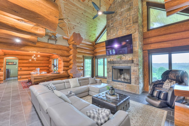 1271 Bivins Rd, Lewisburg, TN 37091 - living area with high vaulted ceiling, arched walkways, ceiling fan, a fireplace, and wood ceiling