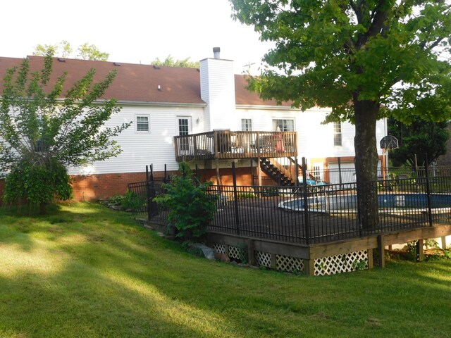 1129 Adam Dr, Cottontown, TN 37048 - rear view of property with a deck, stairs, and a chimney