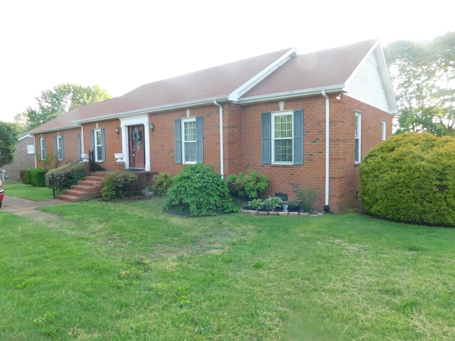 1129 Adam Dr, Cottontown, TN 37048 - single story home with brick siding and a front lawn