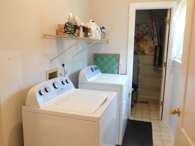 1129 Adam Dr, Cottontown, TN 37048 - laundry area with washing machine and clothes dryer and light tile patterned floors