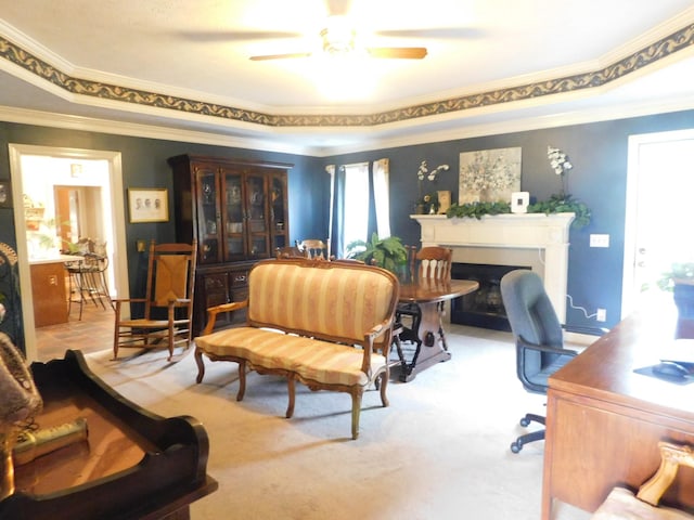 1129 Adam Dr, Cottontown, TN 37048 - office area featuring crown molding, ceiling fan, a fireplace with flush hearth, a raised ceiling, and carpet floors