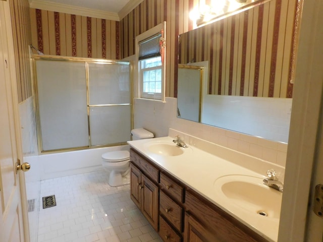 1129 Adam Dr, Cottontown, TN 37048 - bathroom featuring wallpapered walls, toilet, double vanity, shower / bath combination with glass door, and tile patterned floors