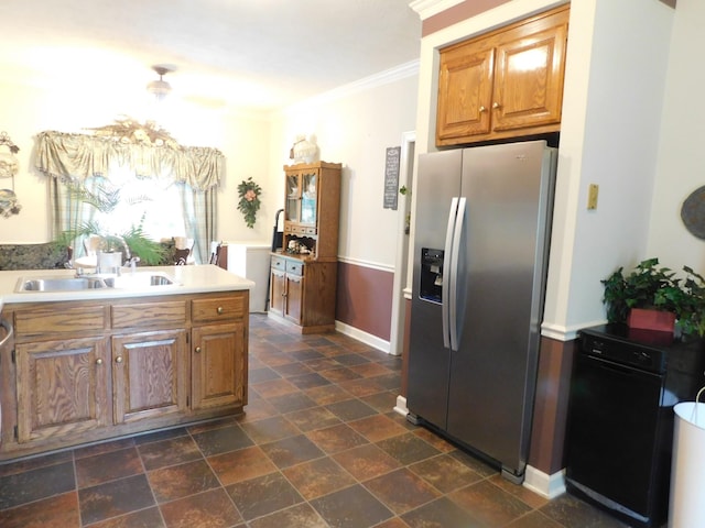 1129 Adam Dr, Cottontown, TN 37048 - kitchen with stainless steel refrigerator with ice dispenser, a sink, ornamental molding, brown cabinetry, and baseboards
