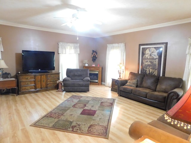 1129 Adam Dr, Cottontown, TN 37048 - living area with wood finished floors, ceiling fan, and crown molding
