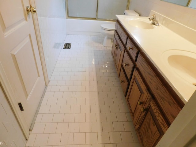 1129 Adam Dr, Cottontown, TN 37048 - full bathroom featuring toilet, tile patterned flooring, double vanity, and enclosed tub / shower combo