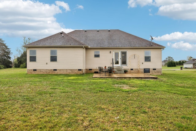 rear view of house with crawl space, a yard, a patio, and a shingled roof