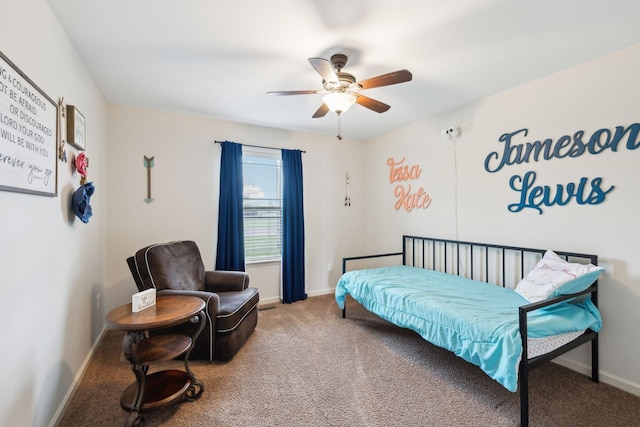 carpeted bedroom with baseboards and a ceiling fan