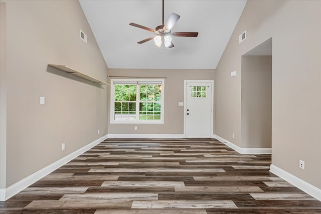 unfurnished living room with a ceiling fan, baseboards, wood finished floors, and high vaulted ceiling