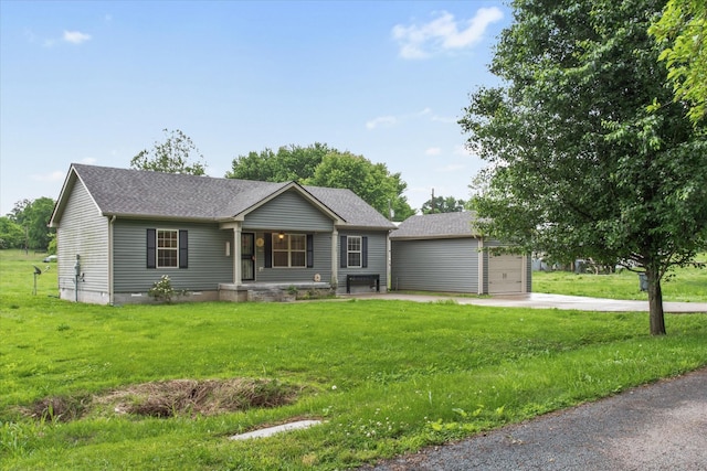 ranch-style house featuring a front lawn, concrete driveway, a shingled roof, and covered porch
