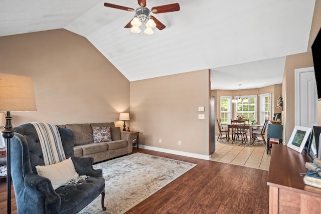 103 Nashay Ct, Portland, TN 37148 - living area featuring ceiling fan, vaulted ceiling, wood finished floors, a chandelier, and baseboards